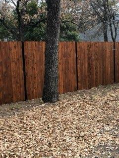 Cedar Fence Built Around a Mature Tree completed by Affordable Fencing in Decatur, TX