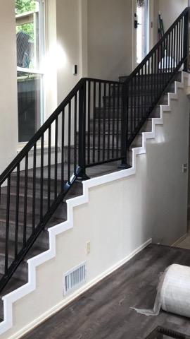 Interior iron stair railing installed by Affordable Fencing