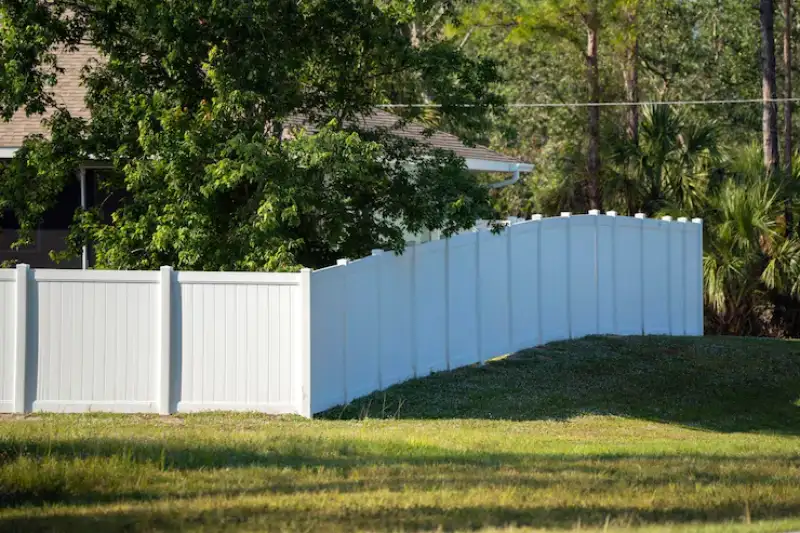 white-vinyl-picket-fence-green-lawn-surrounding-property-grounds-backyard-protection-privacy_127089-33819